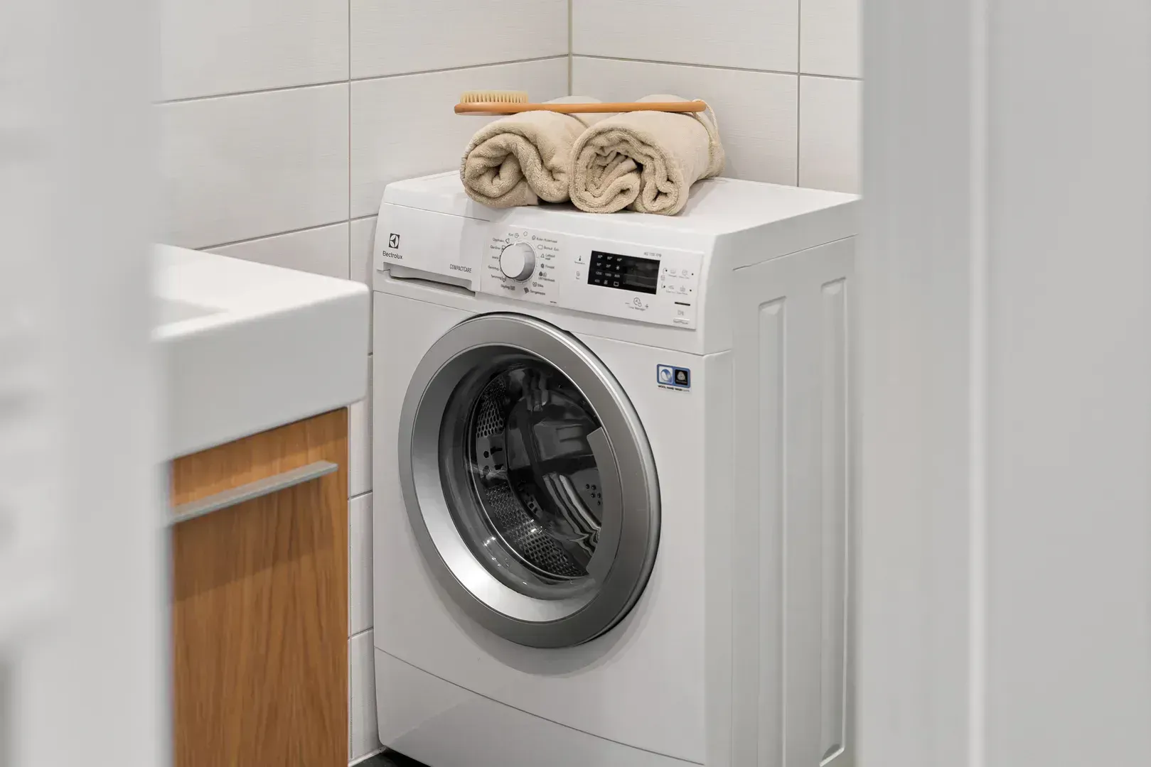 Washing machine in a home laundry corner