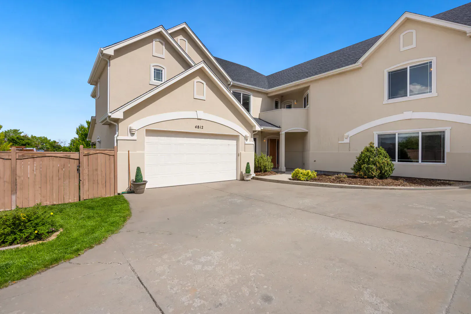 Suburban home with a wide double garage door