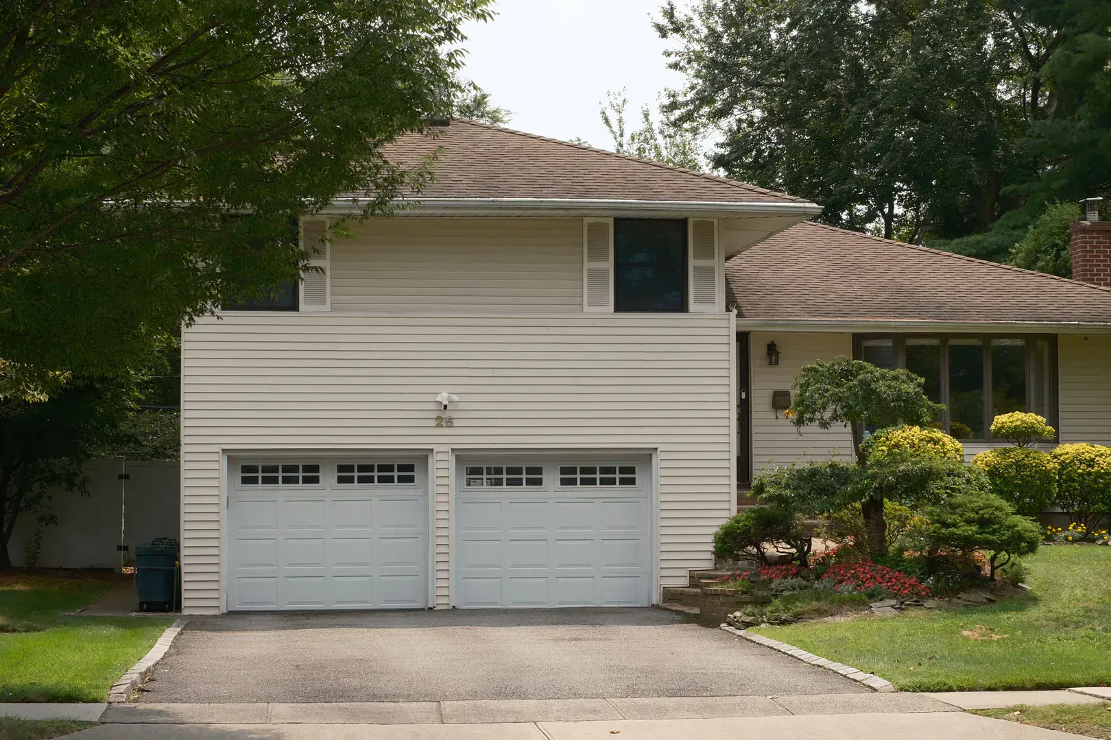 House with a double garage door that cycles thousands of times a year and asks for ten minutes twice